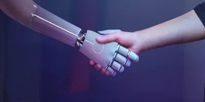 A handshake between a human and a robot.